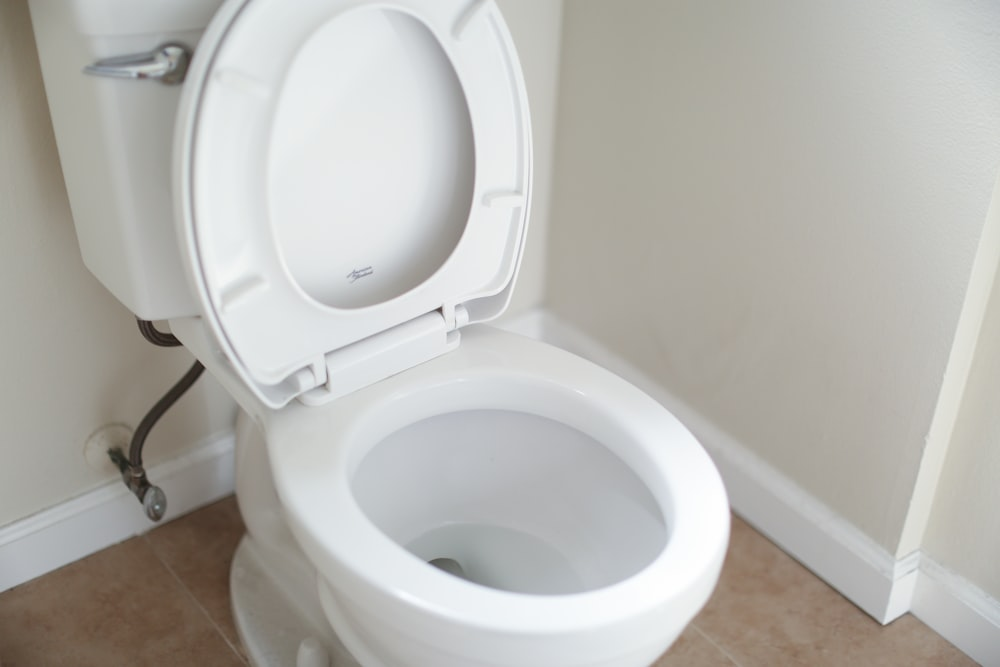 An image of a toilet with the lid up