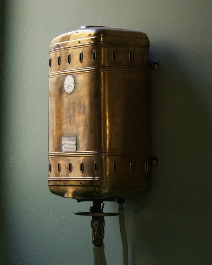 close-up of an old water heater placed on a wall