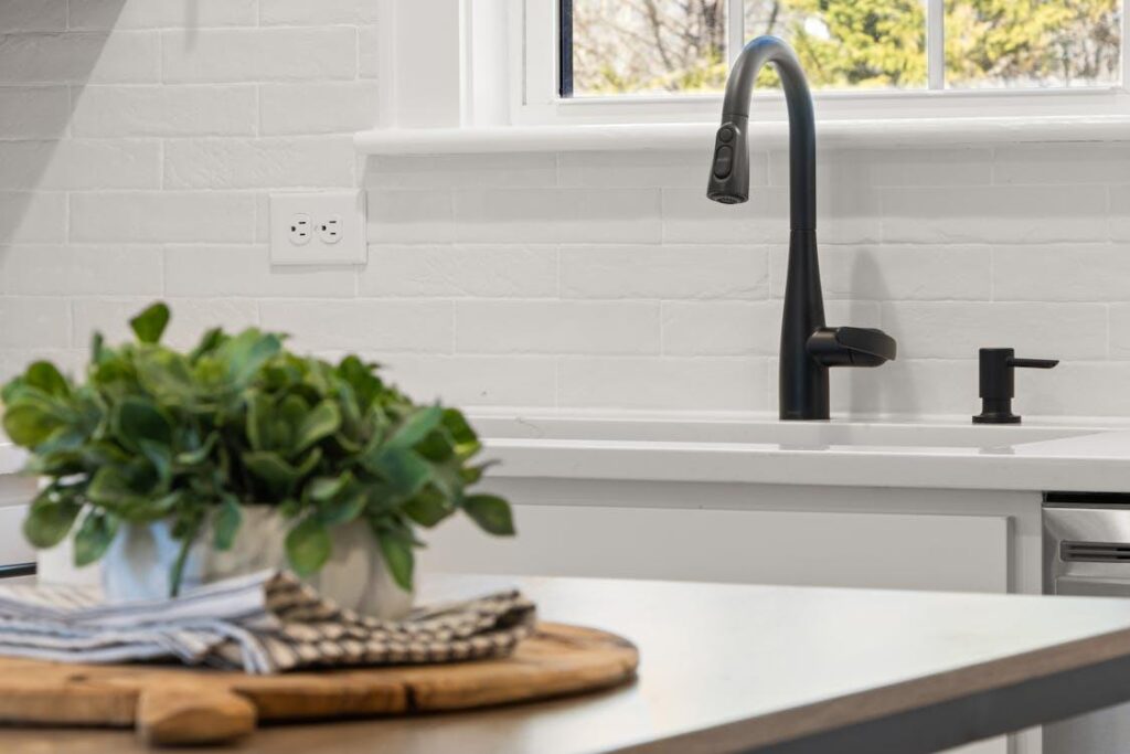 This photo shows a faucet in a kitchen.