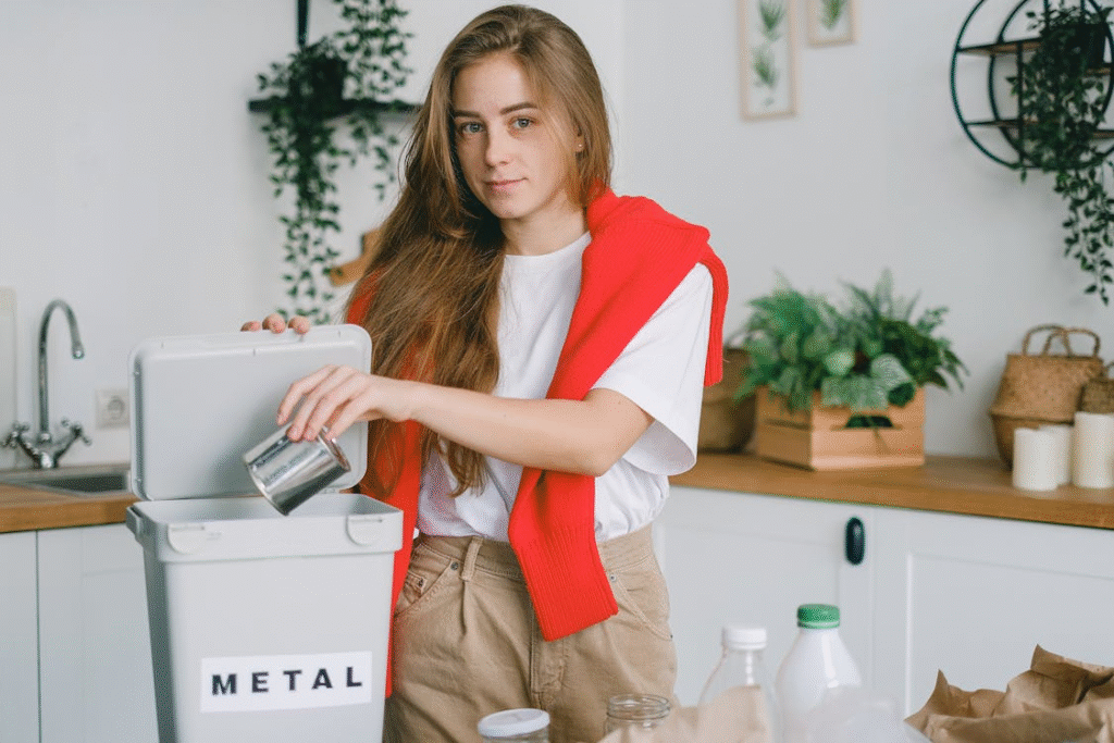 This photo shows a woman disposing of metal.