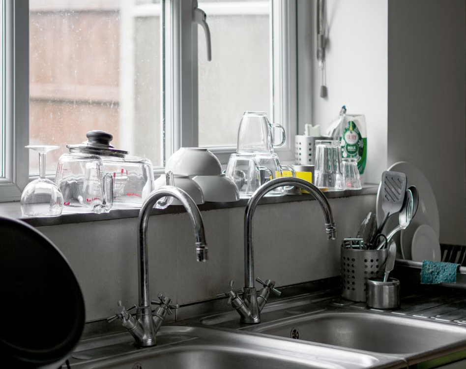 Two kitchen faucets installed into the sinks.